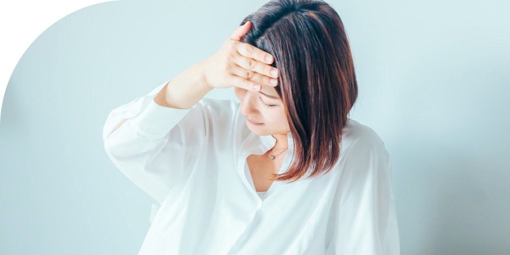 体調不良の女性のイメージ画像